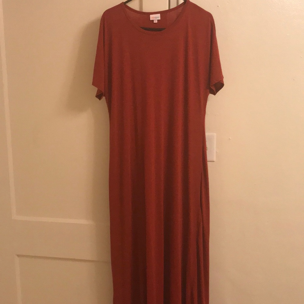 Long red dress with short sleeves.